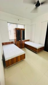 Bedroom Image of Gurbaani Living PG in Rahatani, Pune