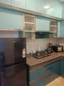 Kitchen Image of 860 Sq.ft 2 BHK Apartment / Flat for rent in Migsun Twiinz, Eta II Greater Noida for Rs. 28000