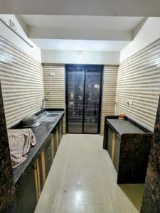 Kitchen Image of 650 Sq.ft 1 BHK Apartment / Flat for sale in Tharwani Vedant Millenia, Titwala Thane for Rs. 2600000