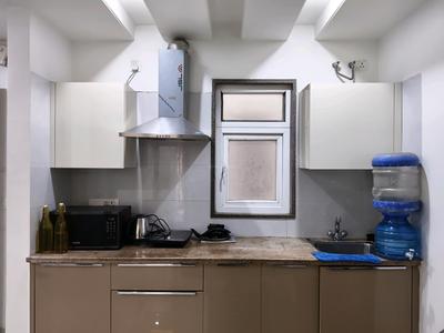 Kitchen Image of 1100 Sq.ft 1 BHK Builder Floor for rent in Sector 56 Gurgaon for Rs. 42000
