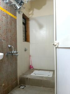 Common Bathroom Image of 700 Sq.ft 2 BHK Apartment / Flat for sale in Puraniks Home Town, Kasarvadavali Thane for Rs. 7600000