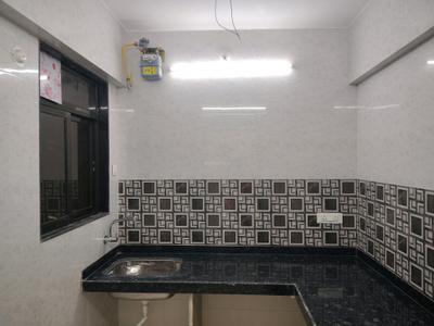 Kitchen Image of 690 Sq.ft 1 BHK Apartment / Flat for rent in Puraniks City Reserva Phase 1, Kasarvadavali Thane for Rs. 16830