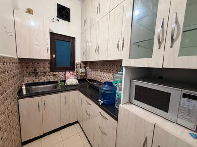 Kitchen Image of 750 Sq.ft 2 BHK Builder Floor for rent in Sector 19 Dwarka New Delhi for Rs. 30000