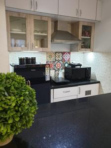 Kitchen Image of 450 Sq.ft 1 BHK Apartment / Flat for rent in Emami Tejomaya, Navalur Chennai for Rs. 150000