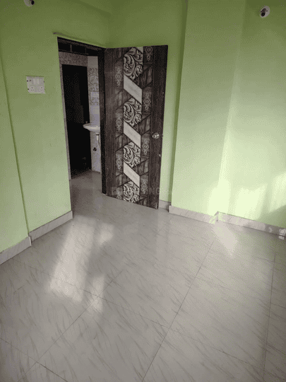 Pragati Apartment Bedroom 1