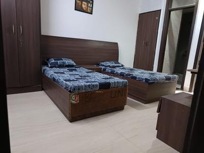 Bedroom Image of ROOMSOOM PG in Sector 27, Noida