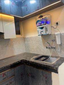 Kitchen Image of 950 Sq.ft 2 BHK Builder Floor for rent in Sector 49 Noida for Rs. 25000