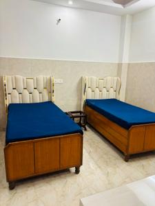 Bedroom Image of Girls PG Universe Home Stay (Mahzoh Luxuria) in Sector 126, Noida