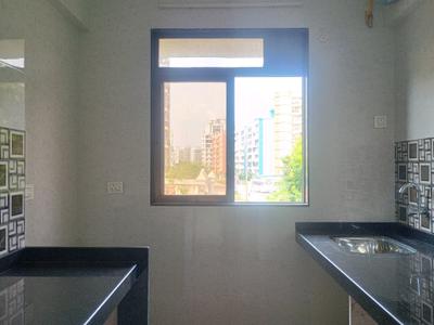 Kitchen Image of 700 Sq.ft 1 BHK Apartment / Flat for sale in Tharwani Vedant Nakshatra, Badlapur West Badlapur for Rs. 2899999