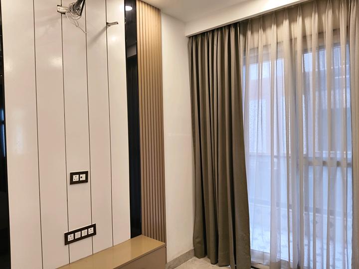 Bedroom with taupe curtains