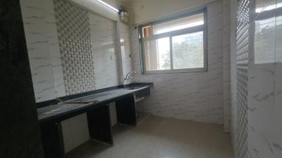 Kitchen Image of 730 Sq.ft 1 BHK Apartment / Flat for rent in Mohan Willows I, Badlapur East Badlapur for Rs. 8000