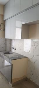 Kitchen Image of 940 Sq.ft 2 BHK Apartment / Flat for rent in Sikka Karnam Greens, Sector 143B Noida for Rs. 27000