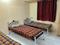 Bedroom Image of the yellow castle men pg  in Ekkatuthangal, Chennai