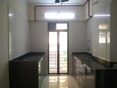 Kitchen Image of 950 Sq.ft 2 BHK Apartment / Flat for sale in Ganga CHS by I R Developers Llp, Nalasopara West Nala Sopara for Rs. 6000000