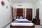 Bedroom Image of HelloWorld Eastern Club in New Town, Kolkata