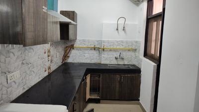 Kitchen Image of 885 Sq.ft 2 BHK Apartment / Flat for sale in Techman Moti Residency, Sikrod Ghaziabad for Rs. 4650000