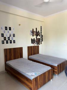 Bedroom Image of Apna niwas pg in Sector 18, Noida