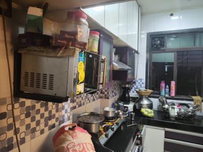 Kitchen Image of 700 Sq.ft 1 BHK Apartment / Flat for rent in Raunak Heights H2 And H3, Kasarvadavali Thane for Rs. 16533
