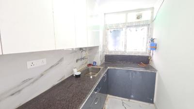 Kitchen Image of 915 Sq.ft 3 BHK Builder Floor for rent in Bharat Vihar New Delhi for Rs. 22500