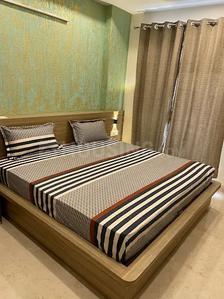 Bedroom Image of ROOMSOOM PG in Sector 16, Noida
