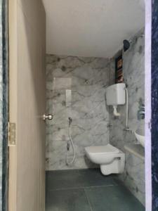 Common Bathroom Image of 561 Sq.ft 1 BHK Apartment / Flat for sale in Vasai West Vasai for Rs. 4600000