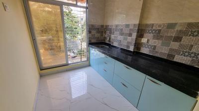Kitchen Image of 850 Sq.ft 1 BHK Apartment / Flat for sale in Sairaj Mohan Plaza, Ulwe Navi Mumbai for Rs. 5500000