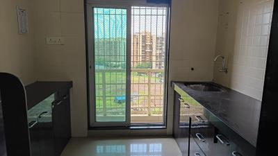 Kitchen Image of 695 Sq.ft 1 BHK Apartment / Flat for rent in Gajra Bhoomi Gardenia, Kalamboli Navi Mumbai for Rs. 19000