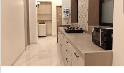 Kitchen Image of Apartment Building in Gamdevi, Mumbai