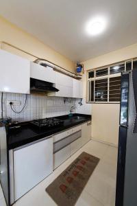Kitchen Image of 921 Sq.ft 2 BHK Apartment / Flat for sale in Austin Park, Tathawade Pune for Rs. 8900000