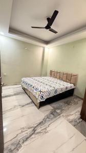 Bedroom Image of 950 Sq.ft 2 BHK Builder Floor for rent in Khirki Extension New Delhi for Rs. 32000