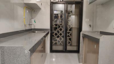 Kitchen Image of 1051 Sq.ft 2 BHK Apartment / Flat for sale in Modirealty Wisteria, Kandivali West Mumbai for Rs. 18100000